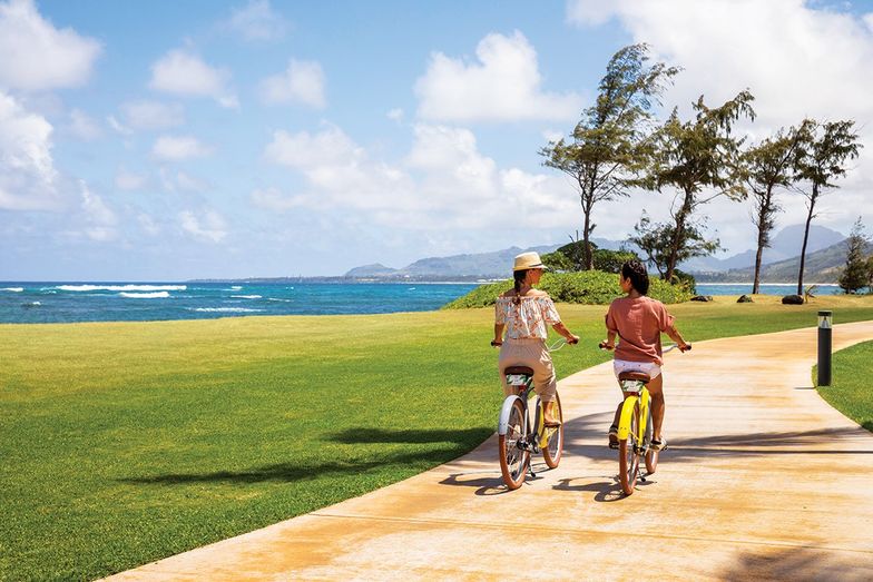 https://www.outtraveler.com/media-library/a-bike-path-snakes-around-kauai-for-miles-u2013-sheraton-kauai-coconut-beach.jpg?id=34875860&width=784&quality=85