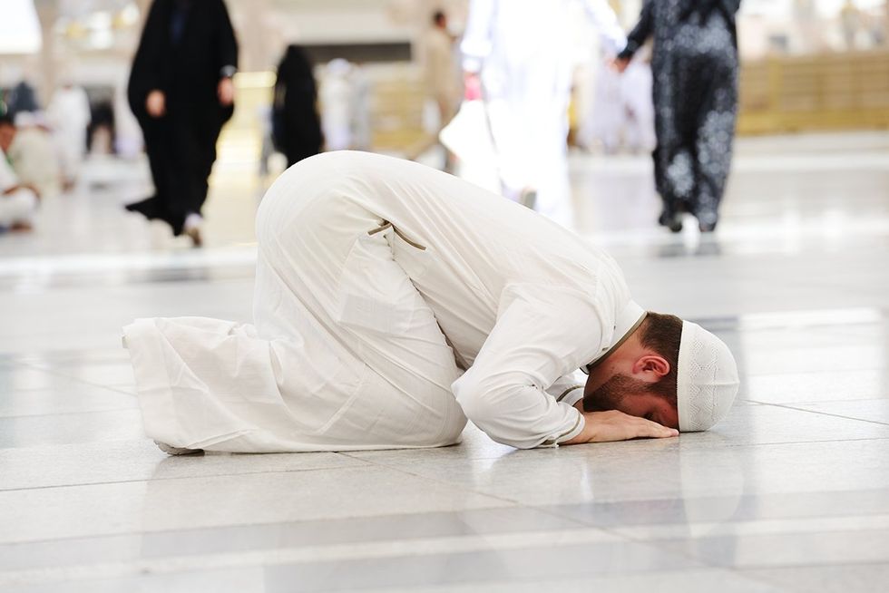 A Muslim man praying in the holy city of Medina, Saudi Arabia