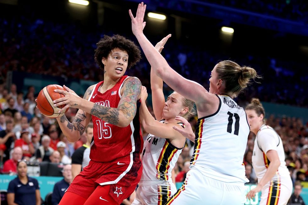 LILLE, FRANCE - AUGUST 01: Brittney Griner #15 of Team United States grabs a rebound over Elise Ramette #4 of Team Belgium during a Women's Basketball Group Phase - Group C game between the United States and Belgium on day six of the Olympic Games Paris 2024 at Stade Pierre Mauroy on August 01, 2024 in Lille, France. (Photo by Gregory Shamus/Getty Images)