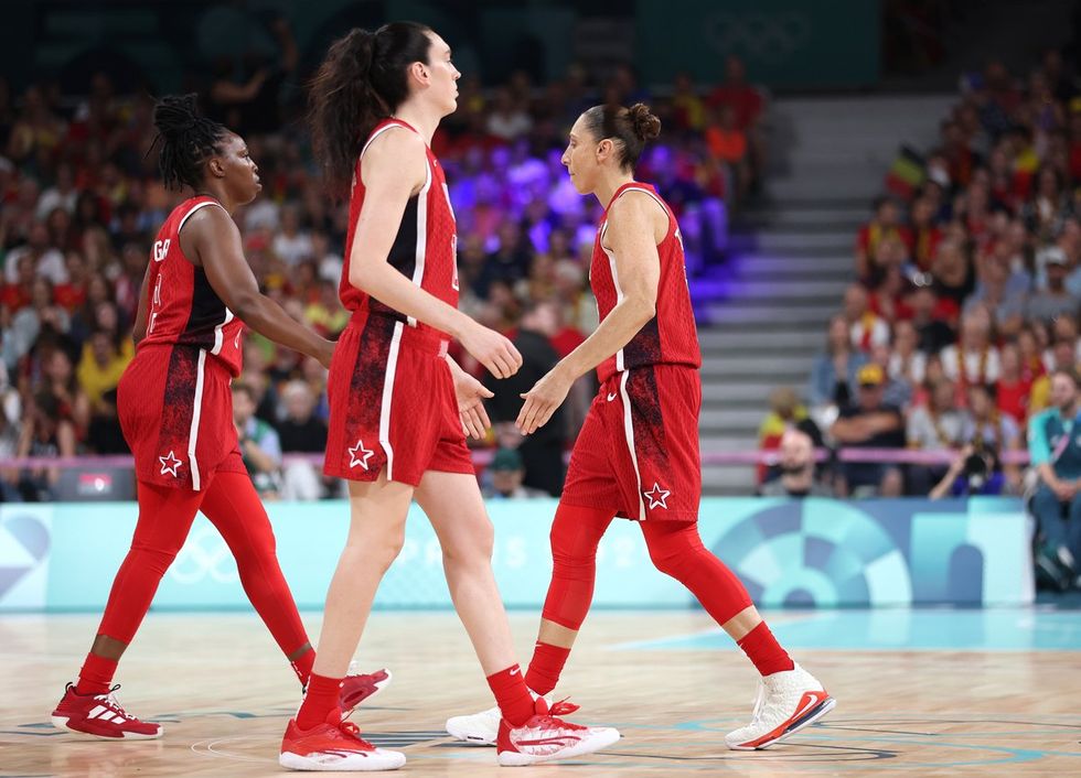 LILLE, FRANCE - AUGUST 01: Diana Taurasi #12 of Team United States high fives Chelsea Gray #8 and Breanna Stewart #10 of Team United States before a Women's Basketball Group Phase - Group C game between the United States and Belgium on day six of the Olympic Games Paris 2024 at Stade Pierre Mauroy on August 01, 2024 in Lille, France. (Photo by Gregory Shamus/Getty Images)