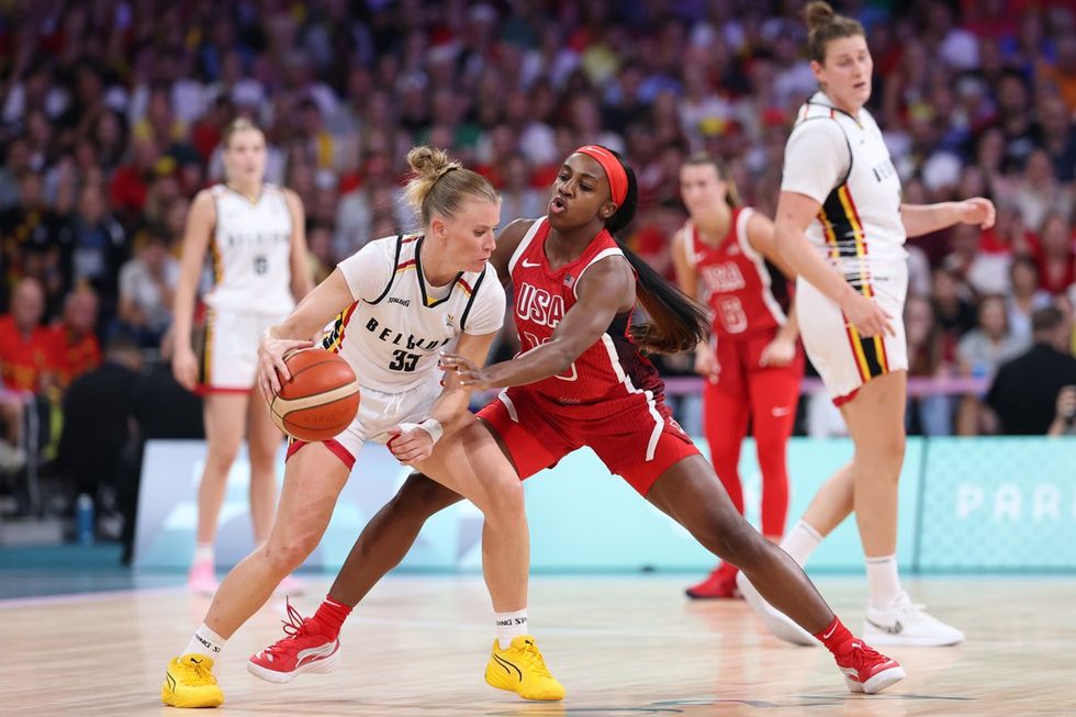 LILLE, FRANCE - AUGUST 01: Jackie Young #13 of Team United States defends Julie Vanloo #35 of Team Belgium during a Women's Basketball Group Phase - Group C game between the United States and Belgium on day six of the Olympic Games Paris 2024 at Stade Pierre Mauroy on August 01, 2024 in Lille, France. (Photo by Gregory Shamus/Getty Images)