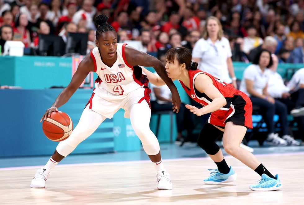 LILLE, FRANCE - JULY 29: Nako Motohashi #15 of Team Japan defends Jewell Loyd #4 of Team United States during the Women's Group Phase - Group C game between Japan and United States on day three of the Olympic Games Paris 2024 at Stade Pierre Mauroy on July 29, 2024 in Lille, France. (Photo by Gregory Shamus/Getty Images)