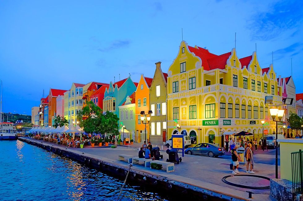 These amazing destinations beckon solo travelers with curated experiences and pricing: The Handelskade merchant houses of Willemstad, Cura\u00e7ao