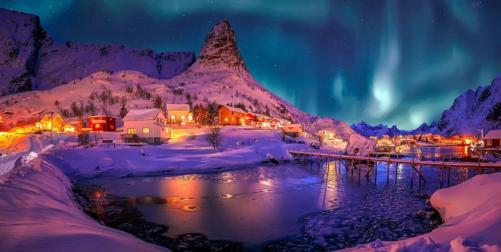 These are the safest countries for LGBTQ+ travelers this fall \u2013 Northern lights fill the night skies above the village of Reine in Norway\u2019s Lofoten Islands