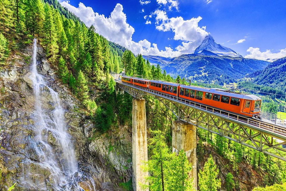 These are the safest countries for LGBTQ+ travelers this fall \u2013 The Gornergrat tourist train crosses a bridge and a waterfall in Zermatt, Switzerland, with the Matterhorn towering in the distance