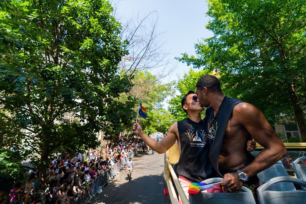 Washington, D.C. Gears Up for WorldPride 2025 - \u200bBarry Hoy and Teraj share a kiss at Capital Pride 2023