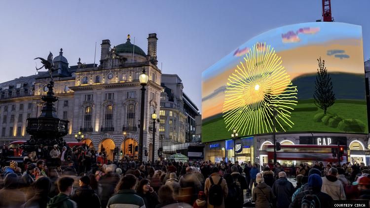 David Hockney's artwork Don't Stare at The Sun... on a big screen in London's Picadilly Circus